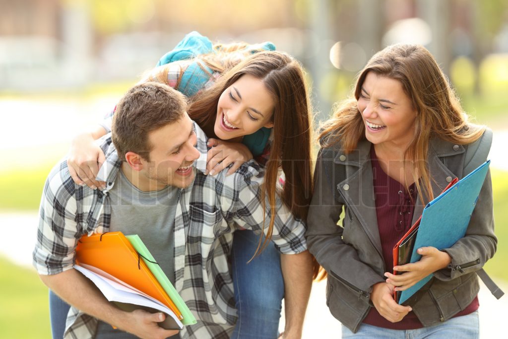 Happy students and friends in a campus