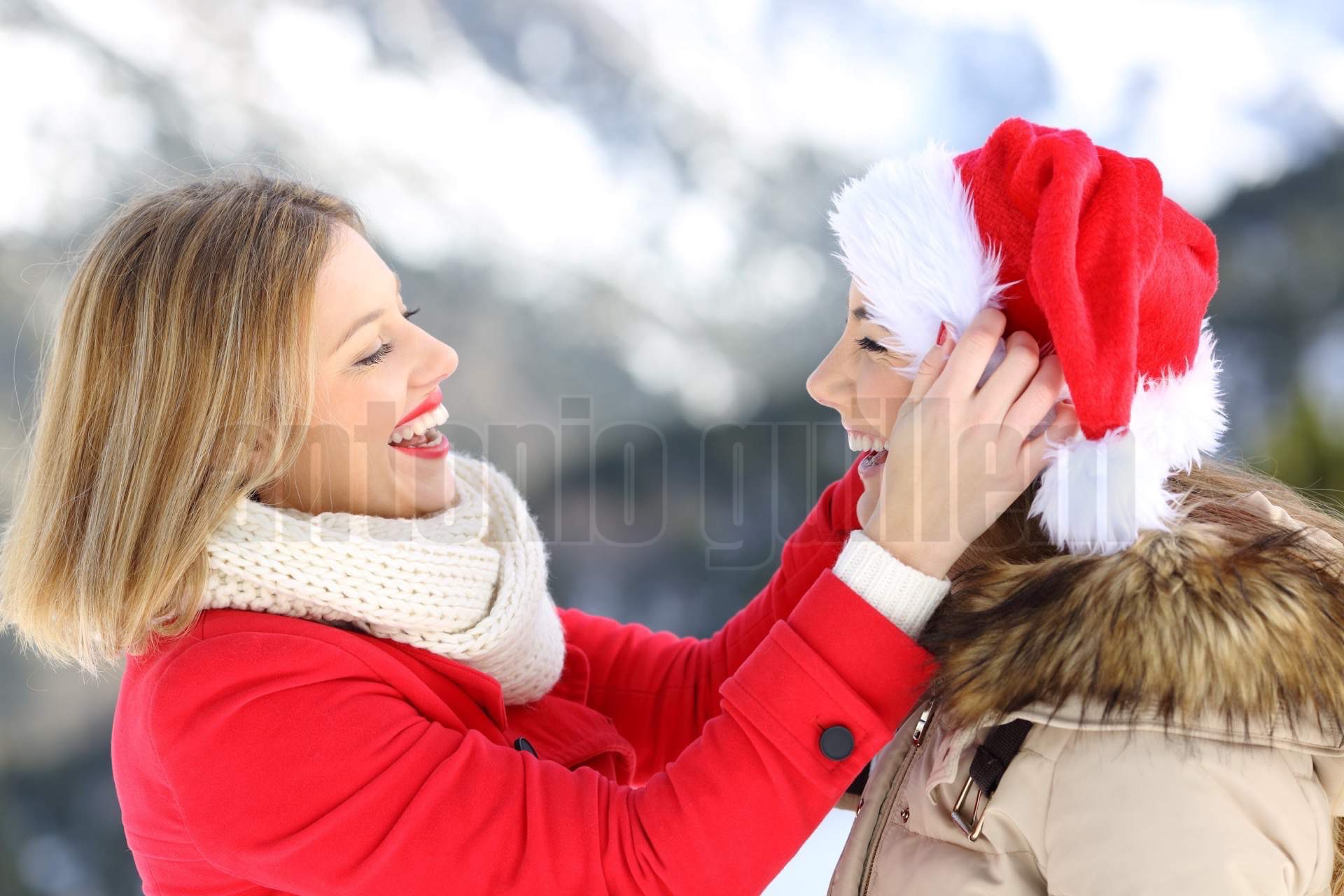 Two friends joking in christmas holidays